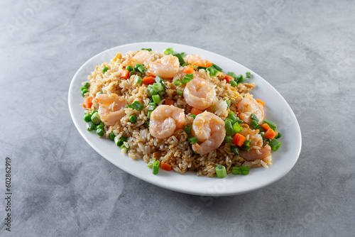 A view of a plate of shrimp fried rice.