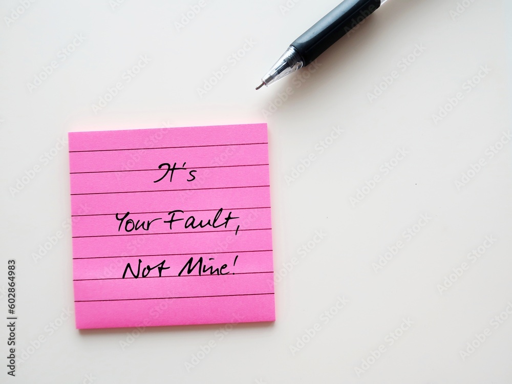 Pink note on white background with pen writing - It's Your Fault, Not Mine - concept of fault finder, people who is very critical and focus on other mistakes, but not see their own