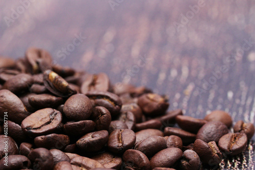 Coffee beans on a woody background