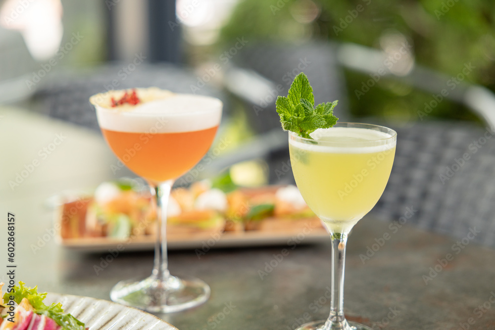 Different delicious summer cocktails on grey table in bar Different delicious summer cocktails on grey table in bar