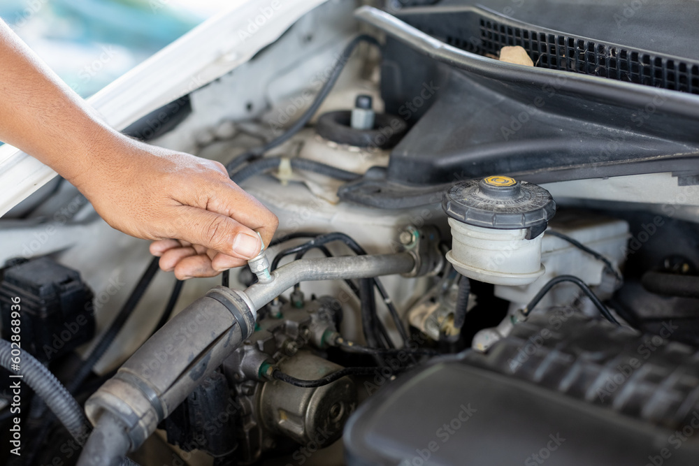 Transportation repair service concept, Repairman auto mechanic check for damage inside engine. man worker service engine mechanic garage. Transportation repair service concept, Repairman auto mechanic check for damage inside engine. man worker service engine mechanic garage.