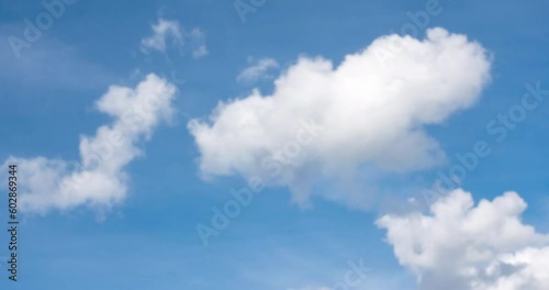 clouds pass in the blue sky