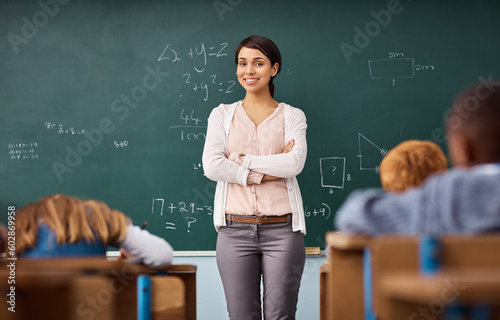 Fotografie Portrait, woman and teacher in a classroom, arms crossed and education with happiness, employment and career