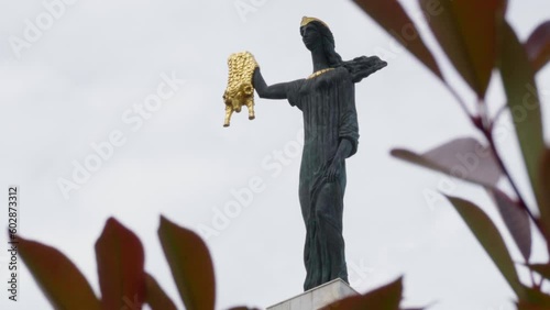 Batumi, Georgia – May 6, 2023: Statue of Medea, a Colchian Princess of the Greek mythology erected on Europe Square in Batumi, Georgia. Medea is holding Golden Fleece in right hand. photo