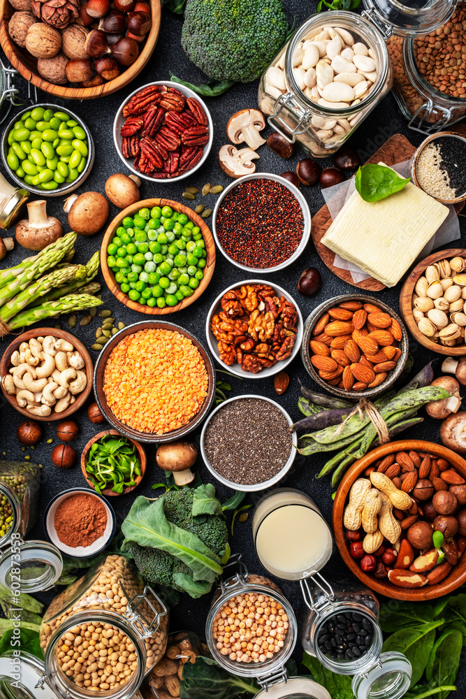 Vegan protein Plant based vegetarian food sources. Healthy eating, diet ingredients: legumes, beans, nuts, alternative milk, tofu, vegetables, seeds and sprouts. Food background. Top view