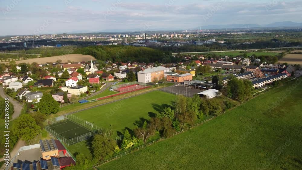Beautiful summer in the European village - green field view on the background of country houses. Hostalkovice, Czech Republic Europa 4K Beautiful summer in the European village - green field view on the background of country houses. Hostalkovice, Czech Republic Europa 4K