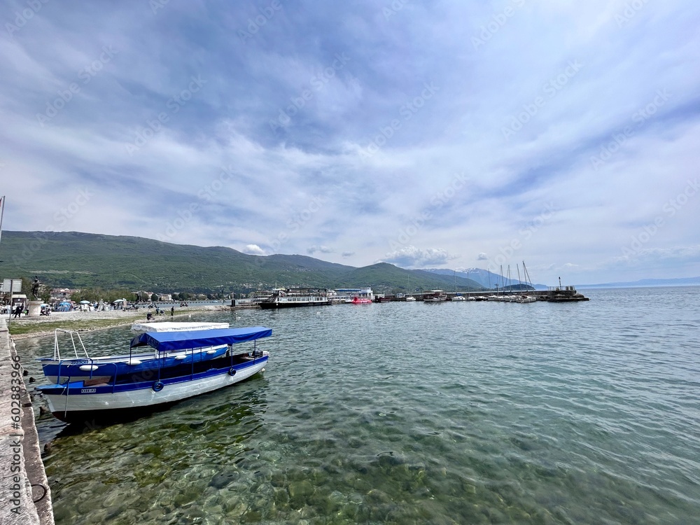 Ohrid lake view on a rainy day. A boat standing on the Ohrid Lake.