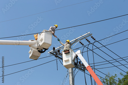 electrician working on a power pole