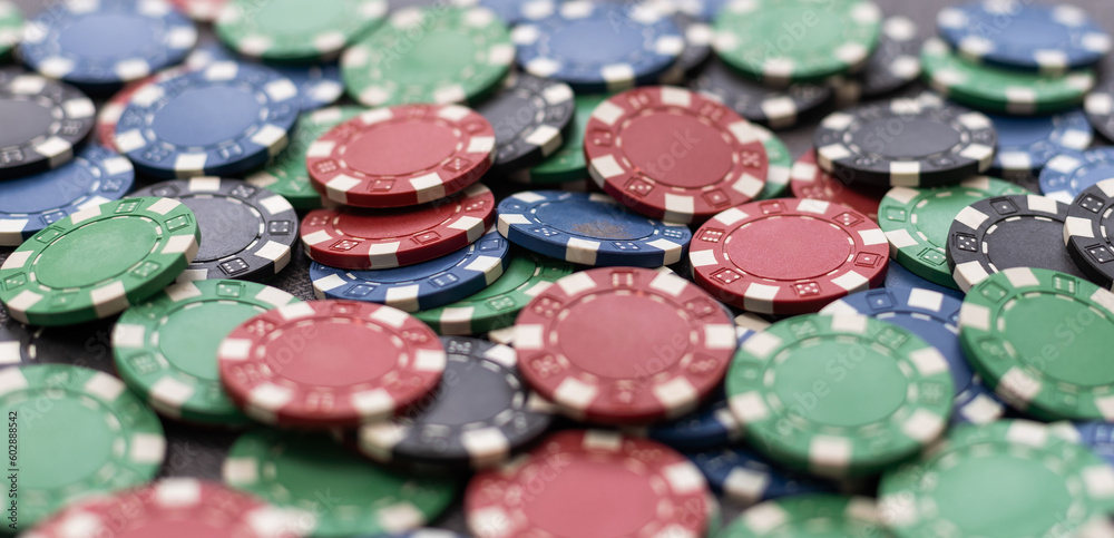 Plastic casino chips background. Poker game Plastic casino chips background. Poker game