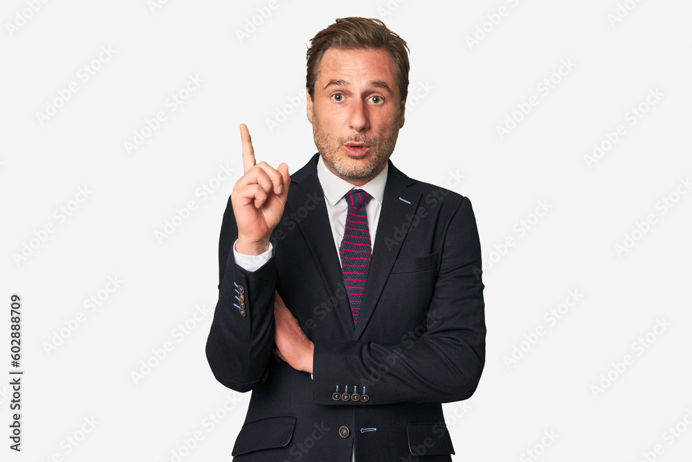 A middle-aged businessman isolated having some great idea, concept of creativity.