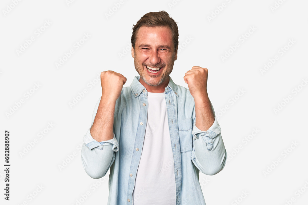 A middle-aged man isolated cheering carefree and excited. Victory concept. A middle-aged man isolated cheering carefree and excited. Victory concept.