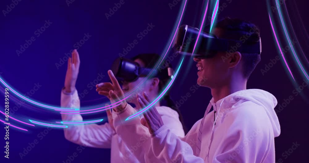 Animation of glowing light trails of data transfer and asian people in vr headset Animation of glowing light trails of data transfer and asian people in vr headset