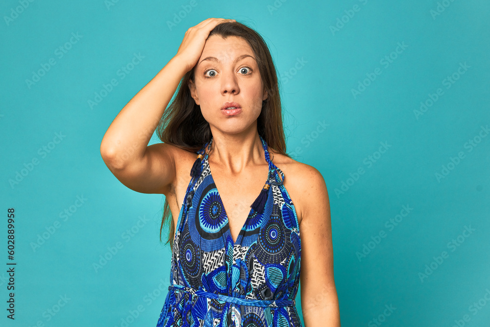 A young caucasian woman isolated being shocked, she has remembered important meeting. A young caucasian woman isolated being shocked, she has remembered important meeting.