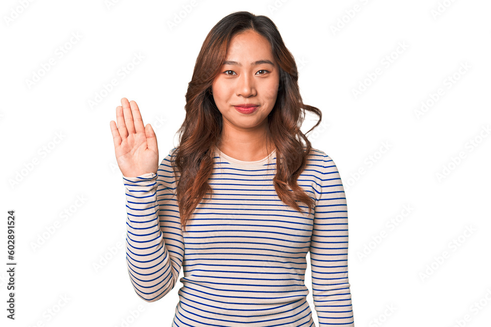 A young chinese woman smiling cheerful showing number five with fingers. A young chinese woman smiling cheerful showing number five with fingers.