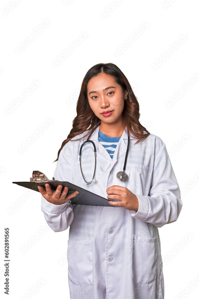 Attentive Chinese woman doctor reading patient report with professional care. Attentive Chinese woman doctor reading patient report with professional care.