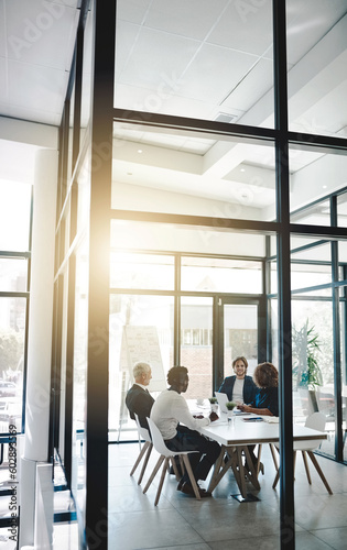 Planning, strategy and meeting with business people in boardroom for teamwork, brainstorming and solution. Corporate, collaboration and conference with employees in office for negotiation development