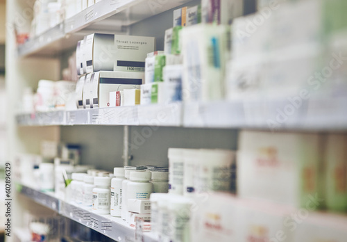 Photos Closeup, pharmacy and medicine with healthcare, pills and shelf with boxes, bottles and treatment