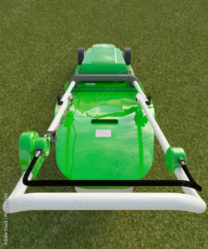Fotografija Looking down onto a modern green electric lawn mower on a bright vibrant summers
