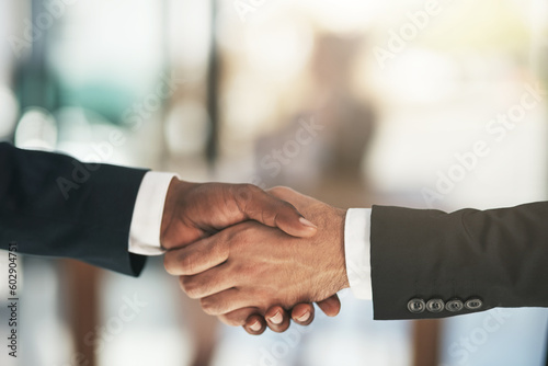 Handshake, partnership and b2b with business people in the office for an agreement or deal together. Thank you, interview and welcome with corporate men shaking hands for greeting during a meeting