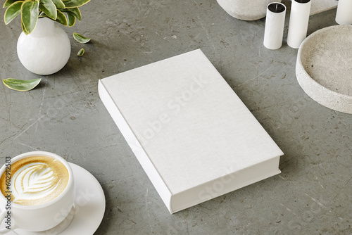 Hard cover book mock up on modern desk for presentation and advertising. 3D rendering
