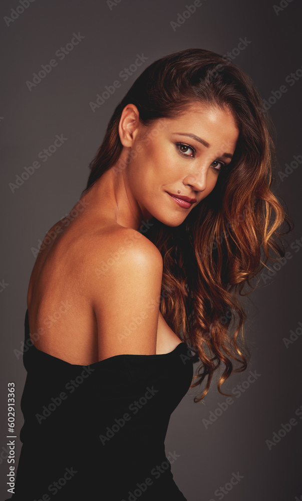 Confident woman, face and beauty portrait in studio for hair care, fashion and style on a grey background. Aesthetic female model person with skin glow, cosmetics and makeup or style motivation Confident woman, face and beauty portrait in studio for hair care, fashion and style on a grey background. Aesthetic female model person with skin glow, cosmetics and makeup or style motivation