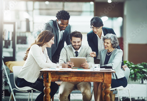 Tablet, happy or business people planning in meeting for team strategy or working on project in company. Online, digital news or employees smiling or talking in group discussion for growth in office