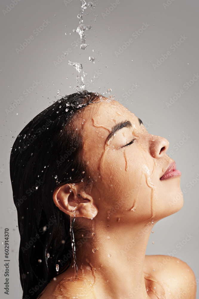Shower, water and face profile of woman in studio on gray background for wellness, cleaning and satisfaction. Skincare, bathroom and female person with beauty for washing hair, hygiene and cleansing
