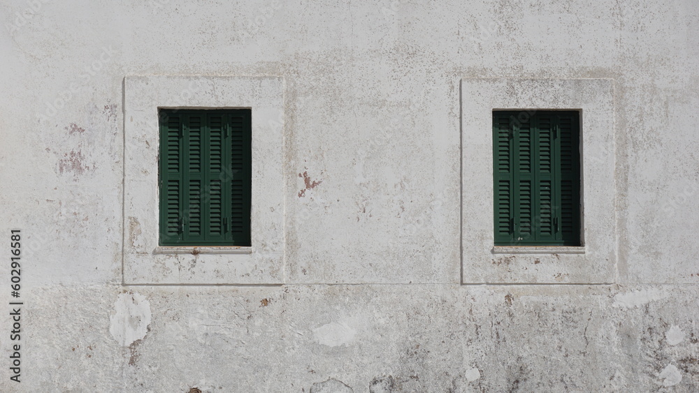 rustic windows on white facade