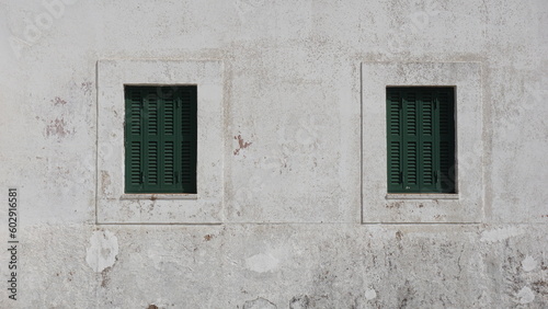 rustic windows on white facade © Esteve