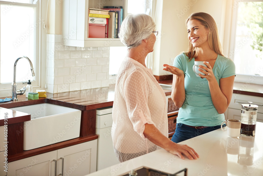 Mother, coffee or happy woman chatting in kitchen in family home bonding or enjoying quality time together. Smile, retirement or daughter talking, relaxing or drinking tea with senior parent on break