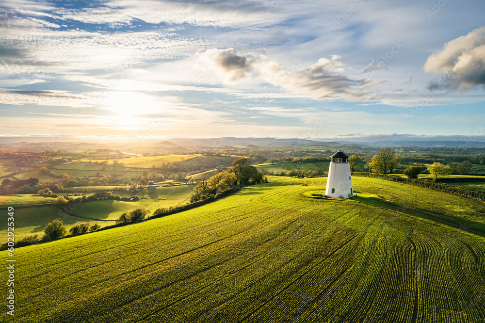 Devon Windmill over fields and farms from a drone, Torquay, Devon, England Devon Windmill over fields and farms from a drone, Torquay, Devon, England