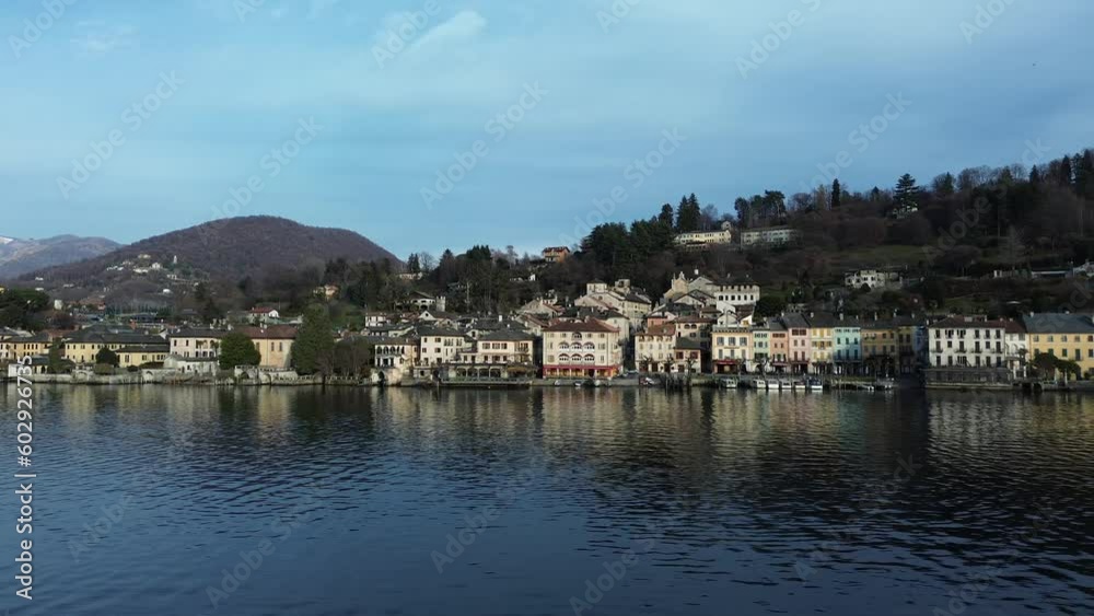 Aerial sideways view of San Giulio town on Lake Orta in Italy Aerial sideways view of San Giulio town on Lake Orta in Italy