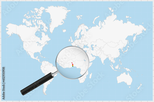 Magnifying glass showing a map of Togo on a world map.