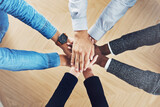 Teamwork, partnership or hands of business people in support for faith, vision or strategy in office. Above, diversity or employees in group collaboration with hope or mission for goals together