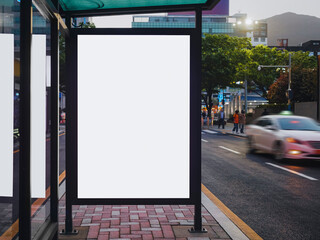 Blank white mock up Media Advertisement at bus stop City street