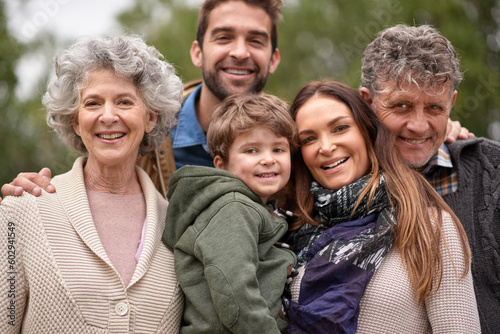 Family  grandparents and portrait of parents with kid in a park on outdoor vacation or holiday together. Face of old people  happiness and happy mother and father for love or care in nature