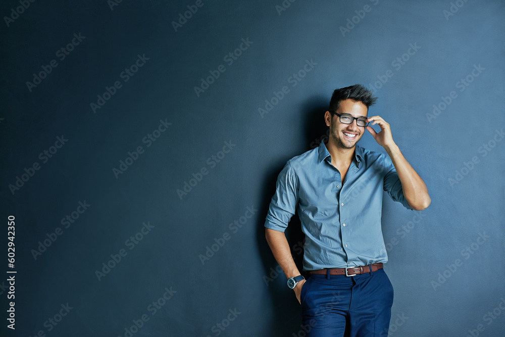 Happy business man, wall background and space with smile, portrait and fashion for entrepreneur in mockup. Excited businessman, holding glasses or smile for career, vision or entrepreneurship mock up
