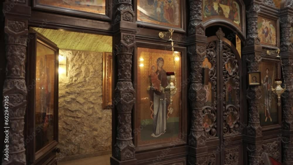 Wooden Iconostasis Decorated with Icons and Golden Icon Lamps in an Orthodox Church Wooden Iconostasis Decorated with Icons and Golden Icon Lamps in an Orthodox Church