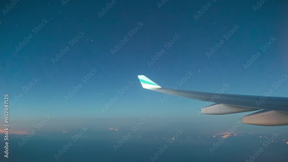Timelapse taken from the airplane window, from the sunset to the night sky. Stars from the window of the airplane. Airbus A330. Timelapse taken from the airplane window, from the sunset to the night sky. Stars from the window of the airplane. Airbus A330.