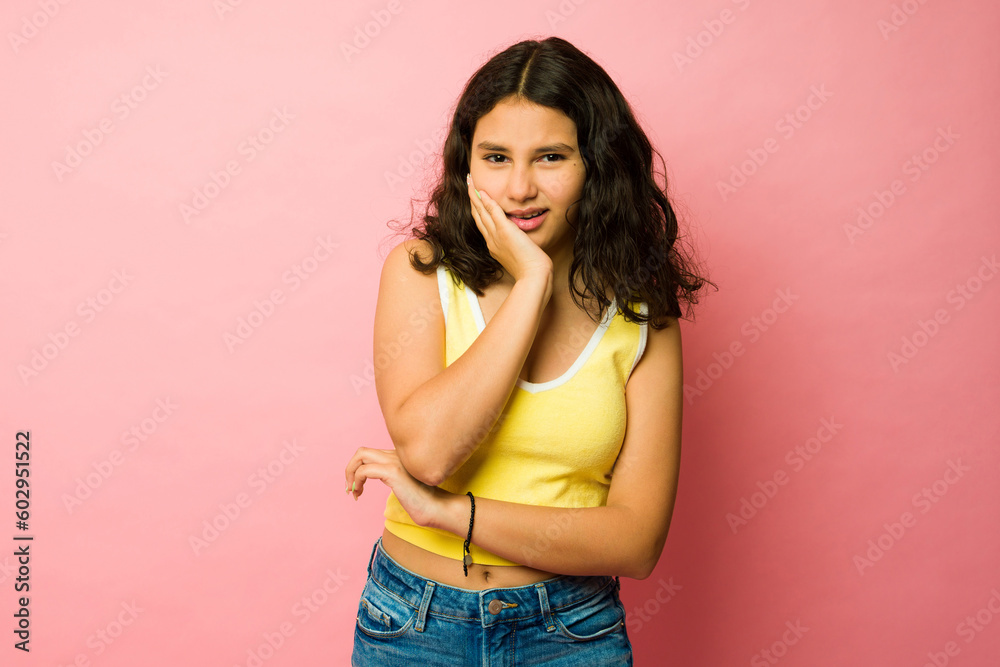 Stressed teenager suffering from toothache Stressed teenager suffering from toothache