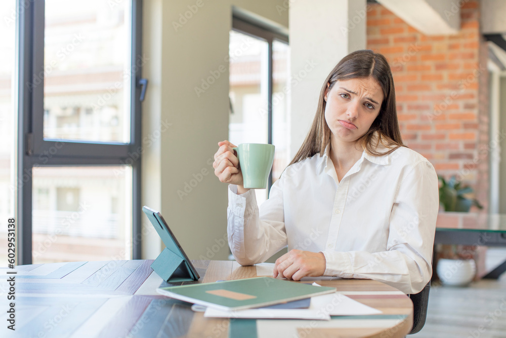 young pretty woman feeling sad and whiney with an unhappy look and crying. telecommuting concept young pretty woman feeling sad and whiney with an unhappy look and crying. telecommuting concept