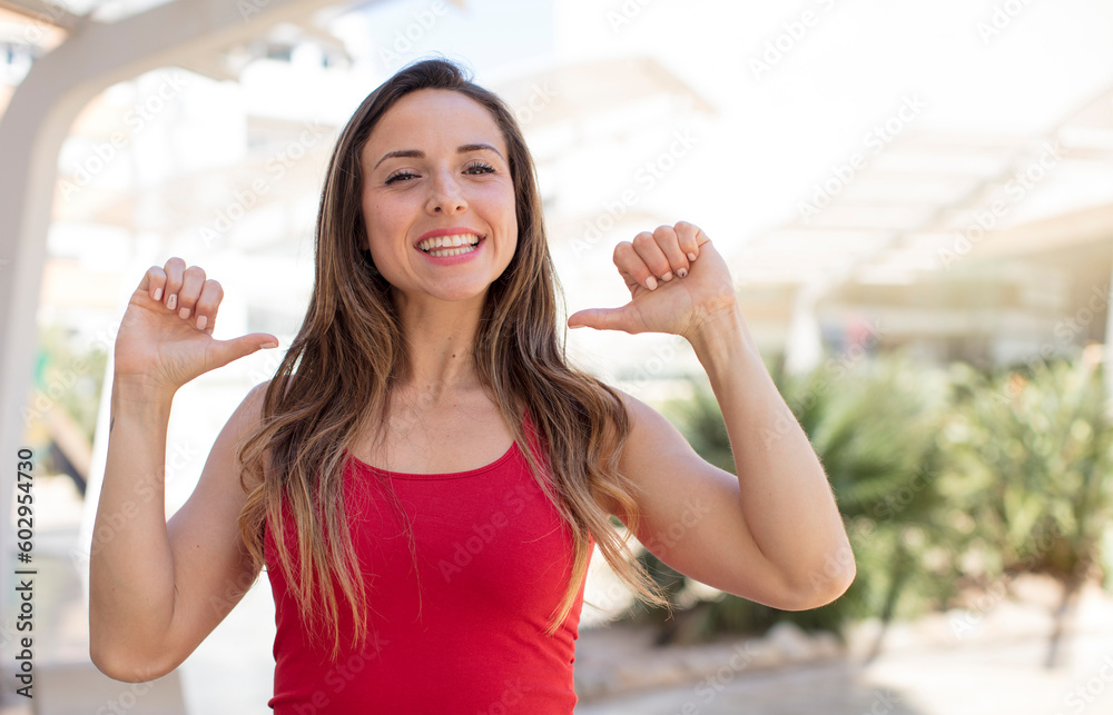 pretty woman feeling proud, arrogant and confident, looking satisfied and successful, pointing to self pretty woman feeling proud, arrogant and confident, looking satisfied and successful, pointing to self