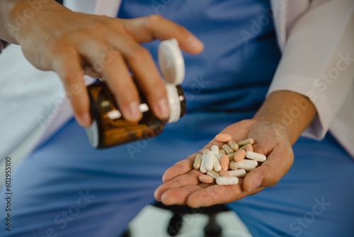 male health concepts. the young man with pain consulted a doctor for treatment. the doctor is interviewing and advising the patients.