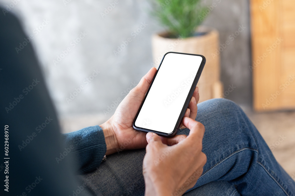 cell phone blank white screen mockup.hand holding texting using mobile on desk at office.background empty space for advertise.work people contact marketing business,technology cell phone blank white screen mockup.hand holding texting using mobile on desk at office.background empty space for advertise.work people contact marketing business,technology