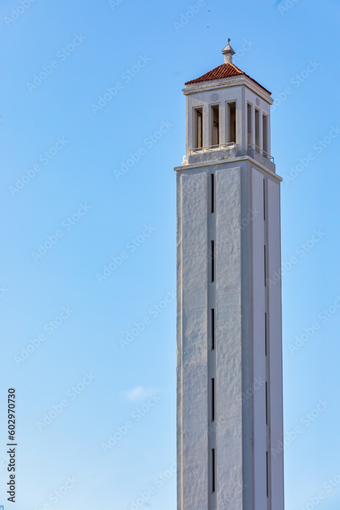 Marathon Tower next to the New Stadium in Castellón de la Plana, Spain: Iconic Architectural Landmarks under a Clear Blue Sky