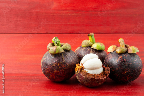 Fresh mangosteen on red background