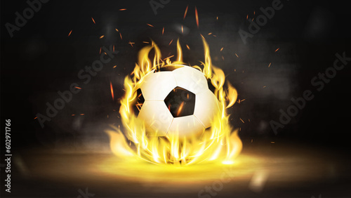 Soccer ball in flame on black smoke background