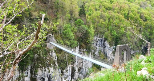 Young couple hiking in the Basque Country near the Holzarte footbridge