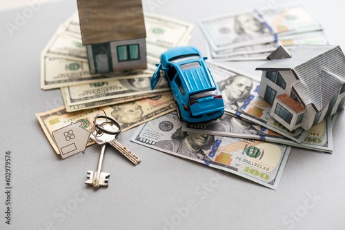 Fotografía Close up of model house and car, money on white table