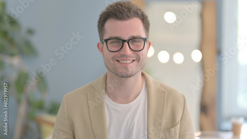 Portrait of Smiling Young Businessman Student Looking at Camera